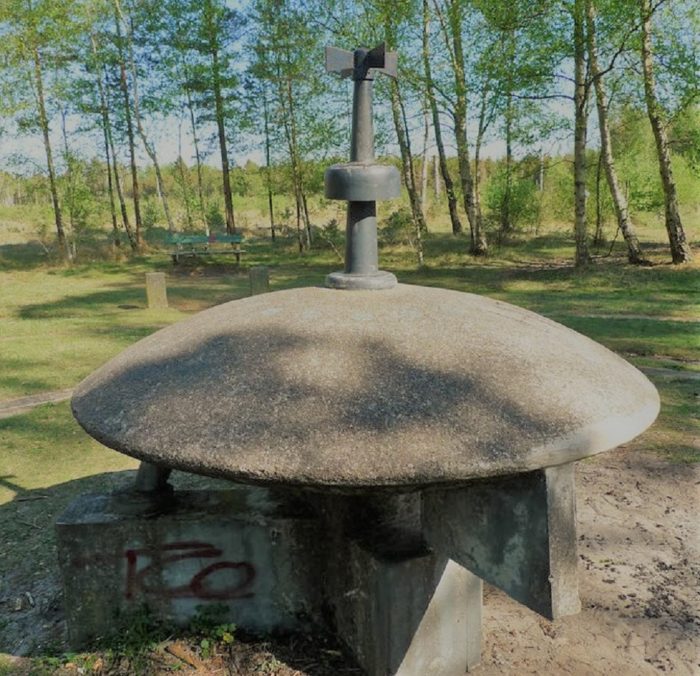 A stone monument of a saucer shaped UFO