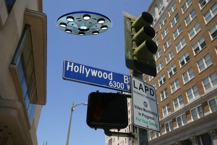 A UFO superimposed onto a ground shot of a Hollywood street