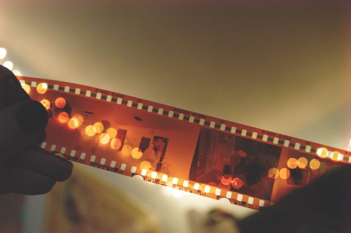 An image of hands holding a film reel