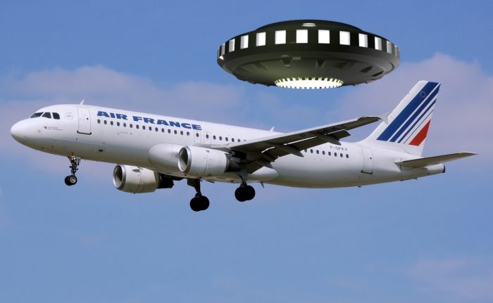 a picture of an Air France plane with a UFO superimposed over the top