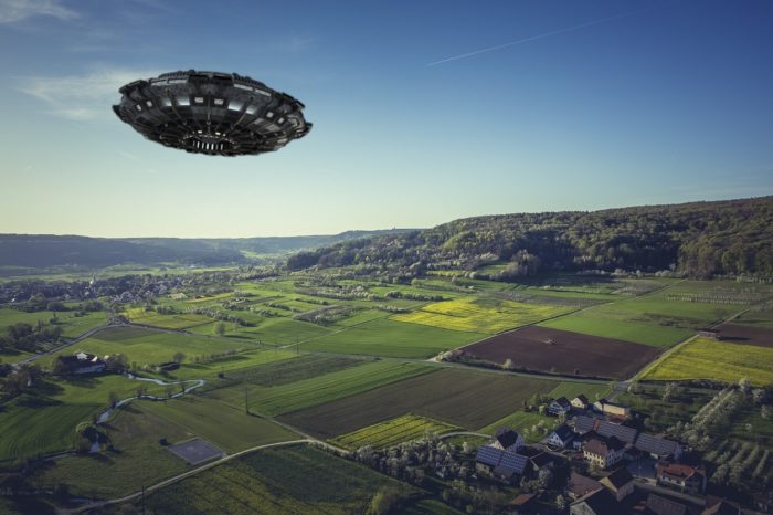 A superimposed UFO over an aerial picture of fields