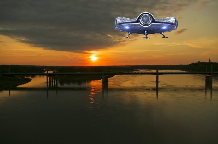 A superimposed UFO on a picture of a river at sunset