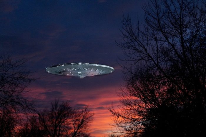 A superimposed UFO on a picture of a sunset sky