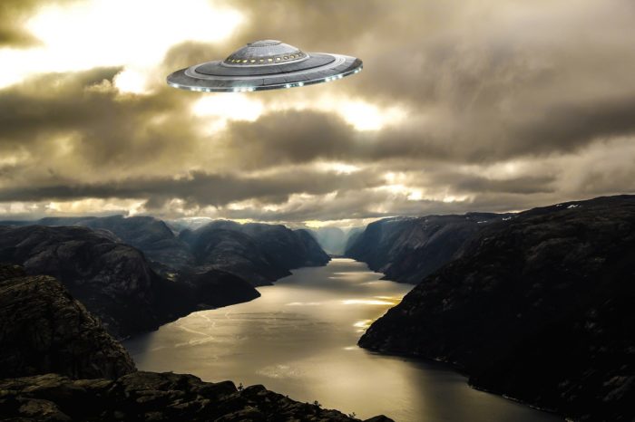 A superimposed UFO over a picture of river at dawn