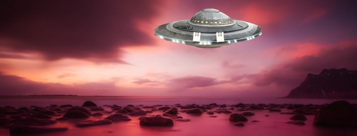 A superimposed UFO over a lake at sunset