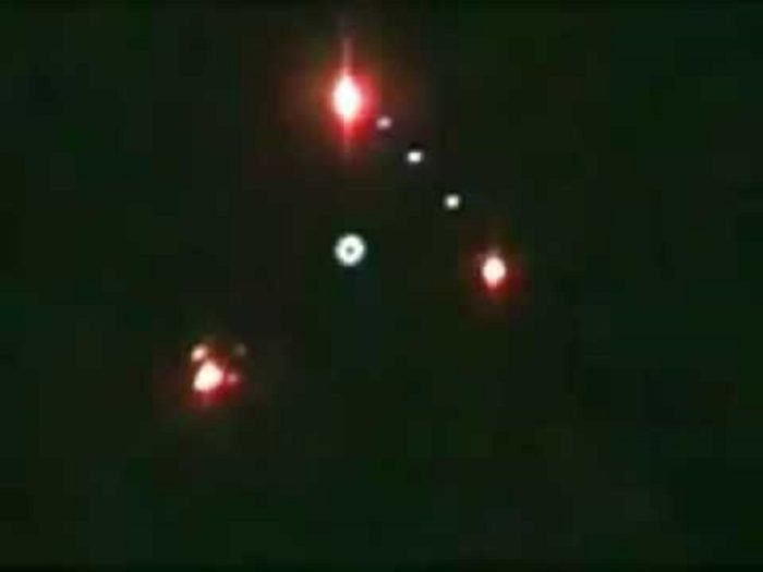 A picture taken directly below an alleged triangular UFO with lights at each corner