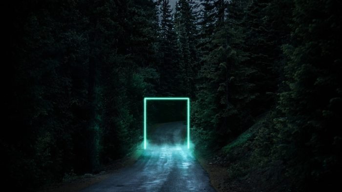 A superimposed portal onto a lonely forest road