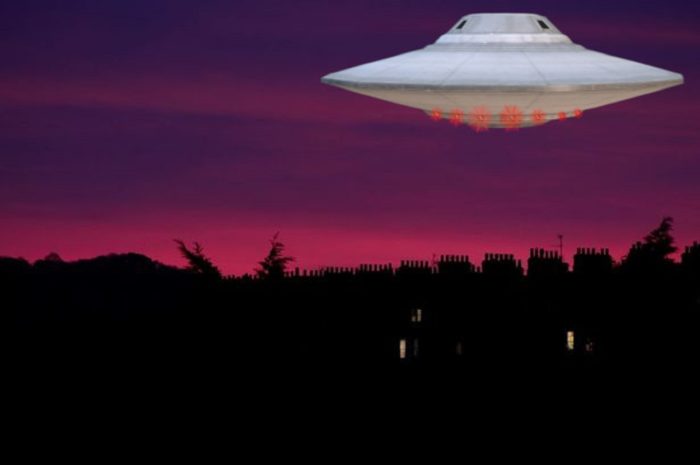 An image showing a UFO over a picture of an evening sky