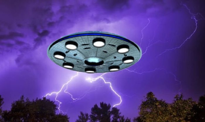 An image of a UFO over a night sky with lightning bolts