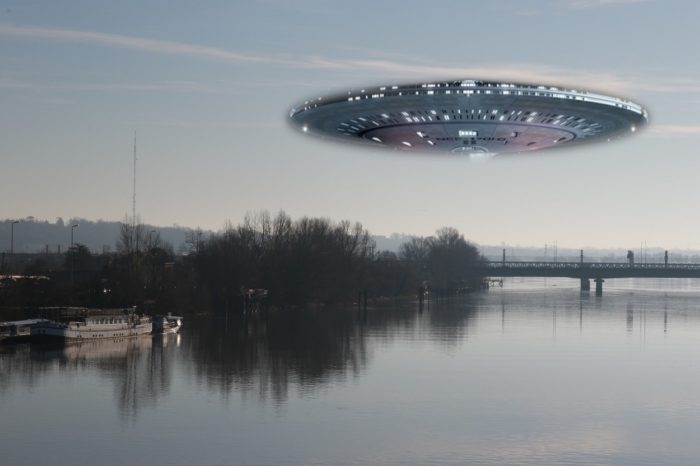 A superimposed UFO over a river during the day