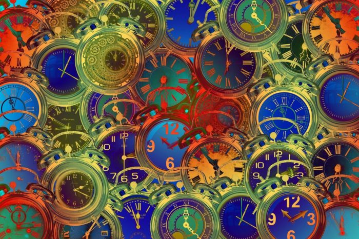 An image of multicolored clocks