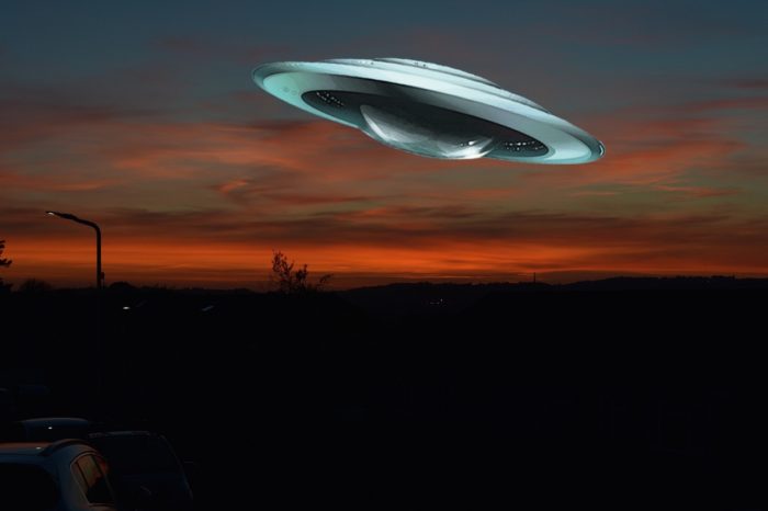A flying saucer superimposed onto a night sky