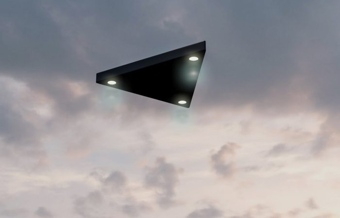 A black triangle UFO in the daytime sky
