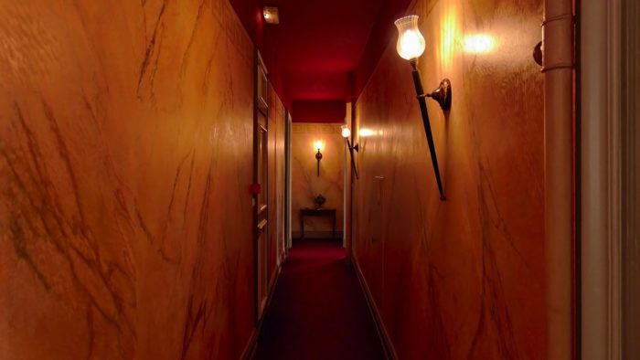 A long old-fashioned hotel corridor