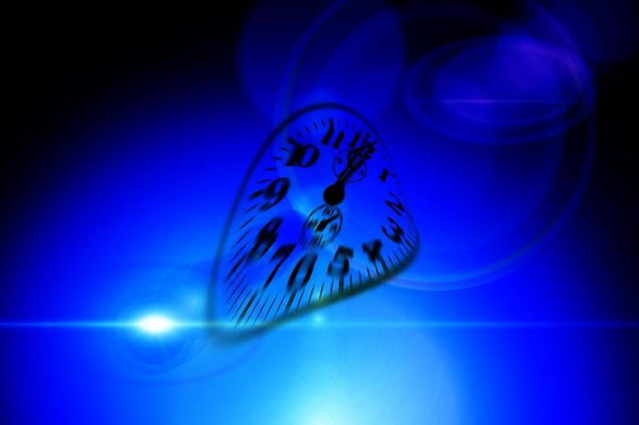 A warped clock face on a deep blue background