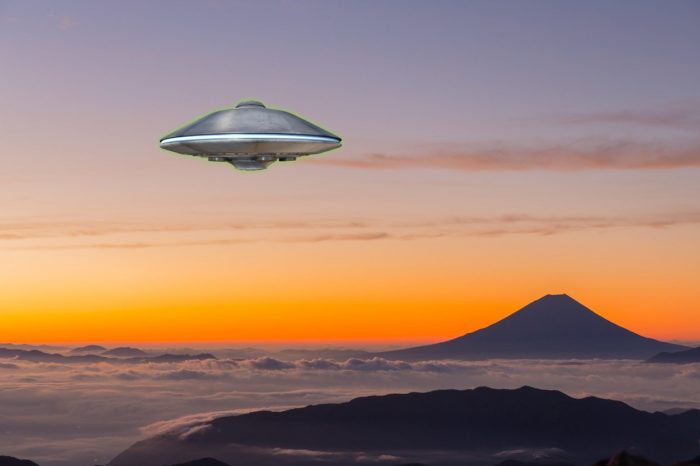 A UFO superimposed onto a picture of large mountain