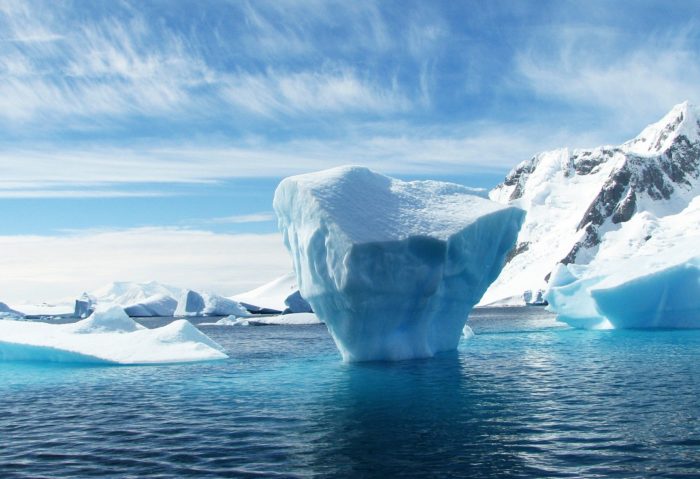 An iceberg floats through the icy waters