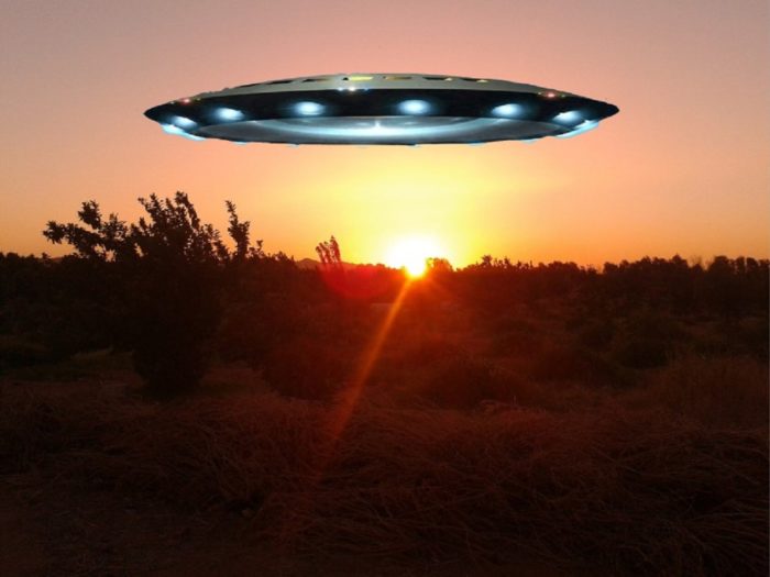 A sunset picture with a superimposed UFO over the top