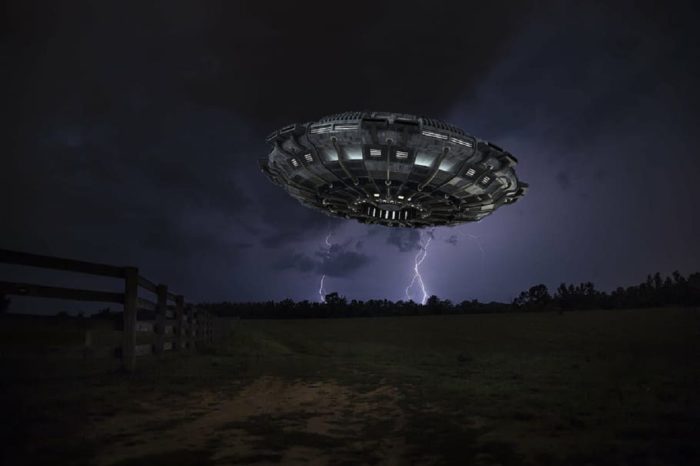 UFO over farmland at night