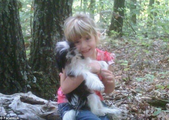 Madyson Jamison holding her dog