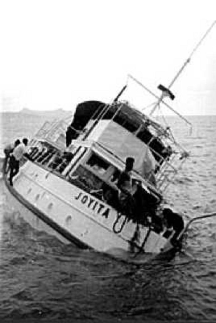 Rescuers examining the remains of the MV Joyita