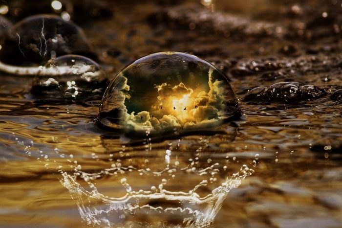 A water droplet with a sky superimposed into it