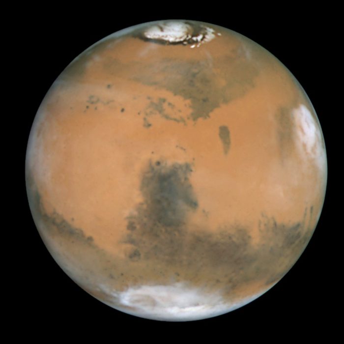 Picture of Mars showing clearing the ice caps at the polar regions