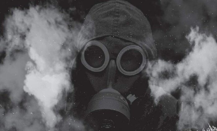 A picture of a person with a gas mask on