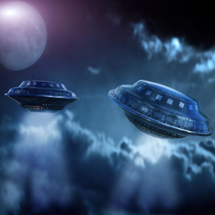 A depiction of two UFOs in a cloudy sky