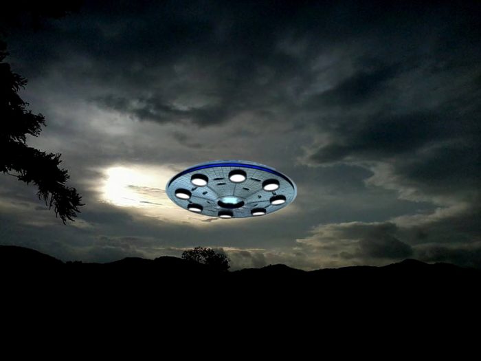 Superimposed UFO in a night sky