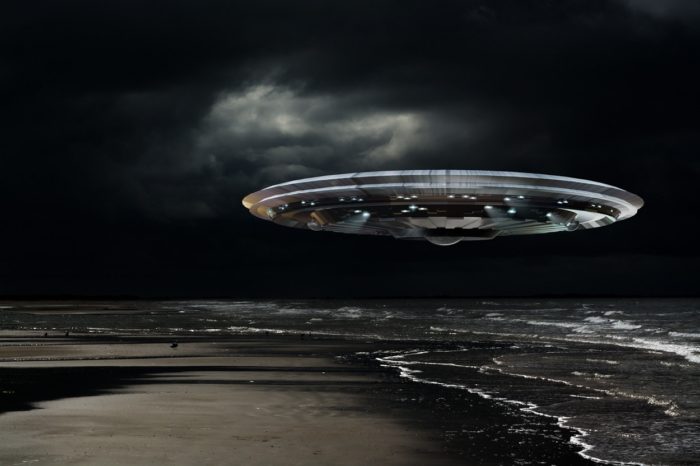 Superimposed UFO onto a beach at night