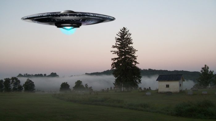 A superimposed UFO over a field