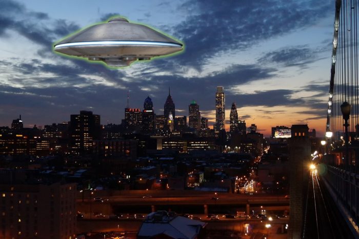 A superimposed UFO over a city at dusk