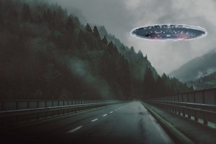 Superimposed UFO over a road