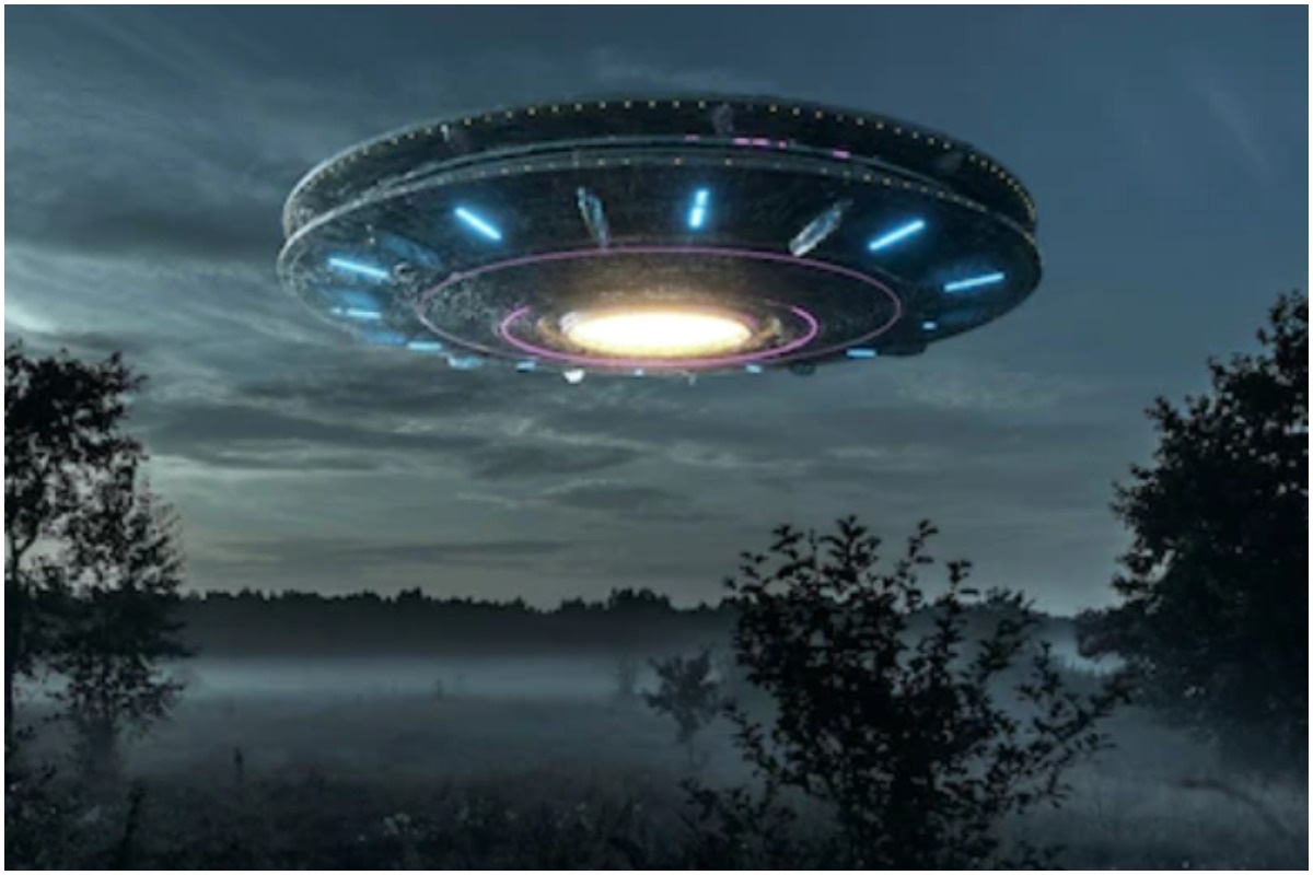 Depiction of a UFO over a forest