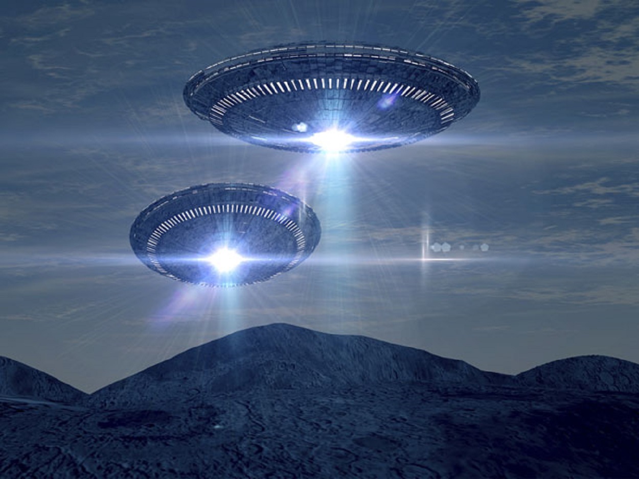 Depiction of two UFOs over mountains