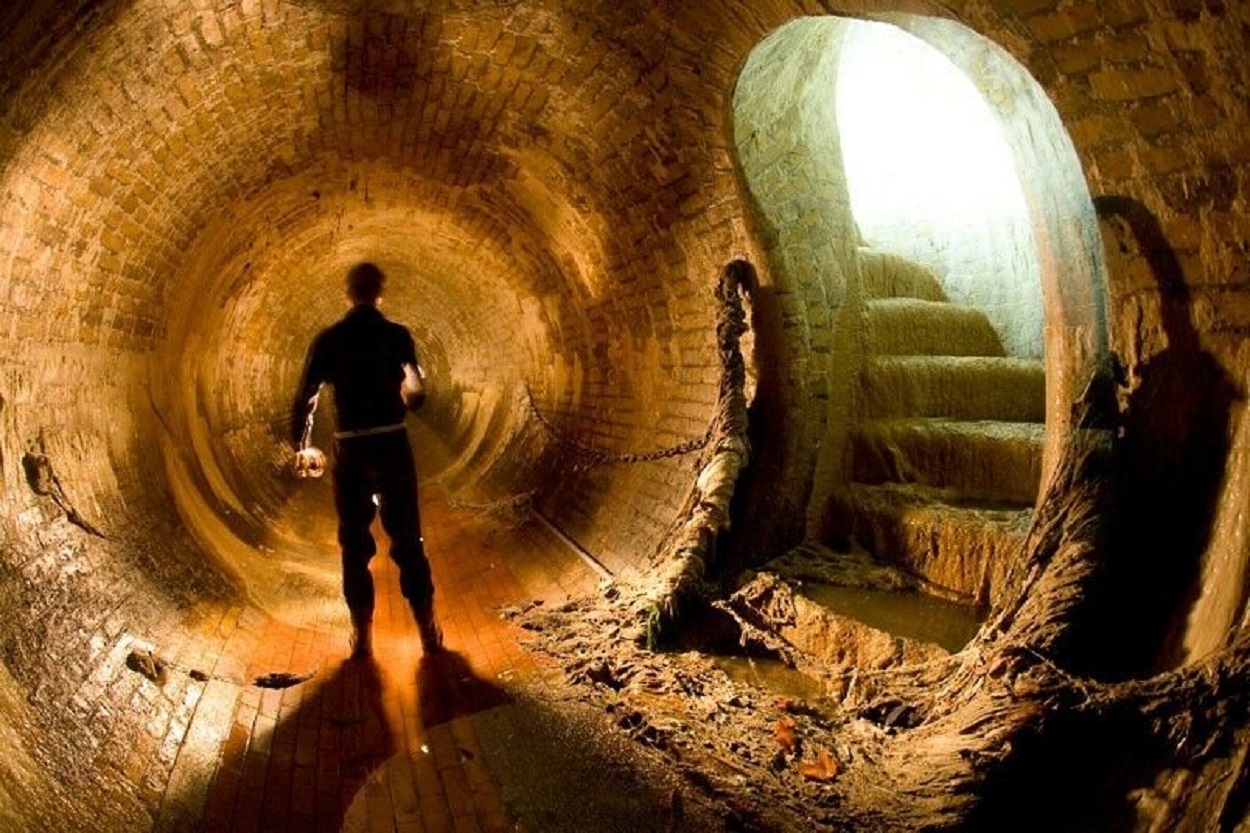 A shadowy figure in a tunnel