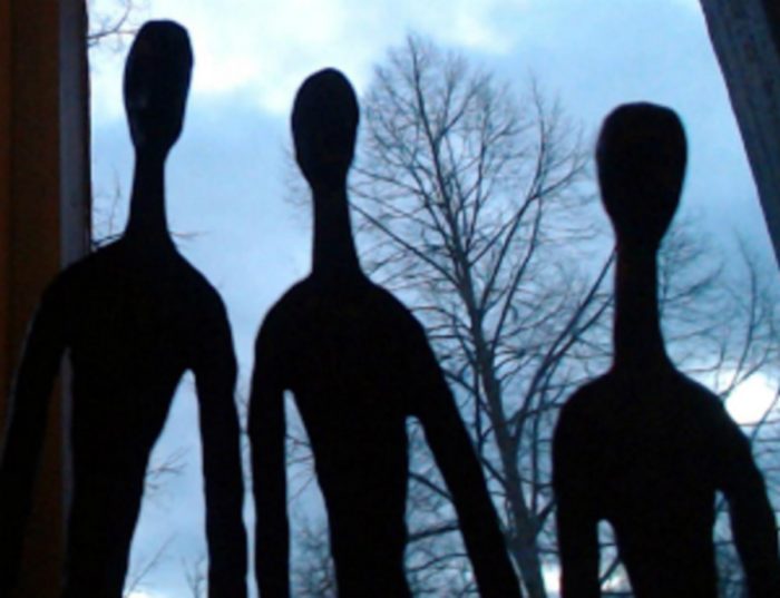 Shadows of three alien entities 