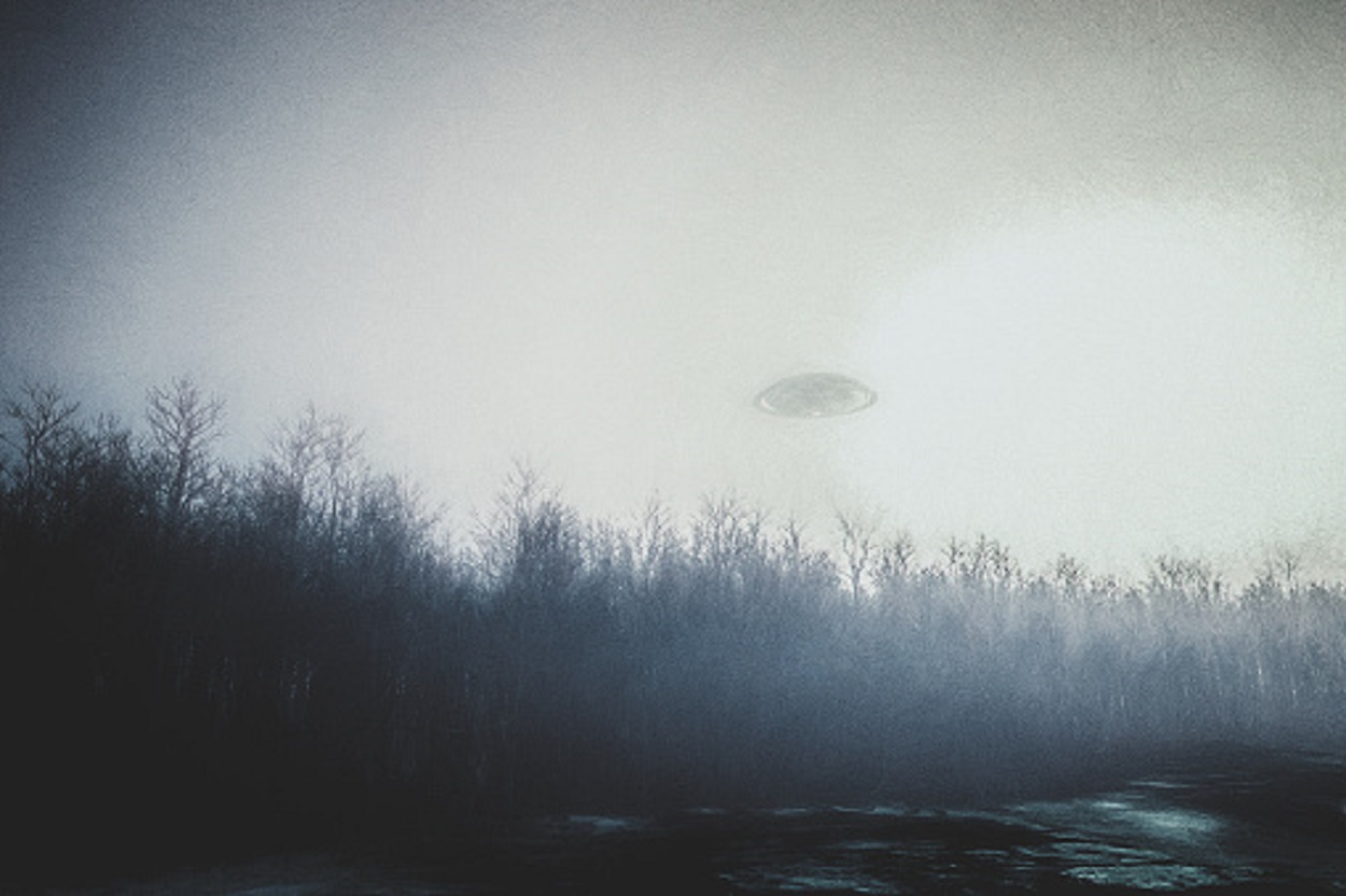 A depiction of a UFO in a cloudy sky