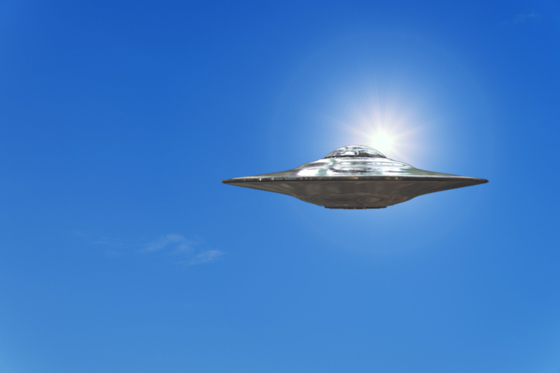 A depiction of a UFO in the daylight sky