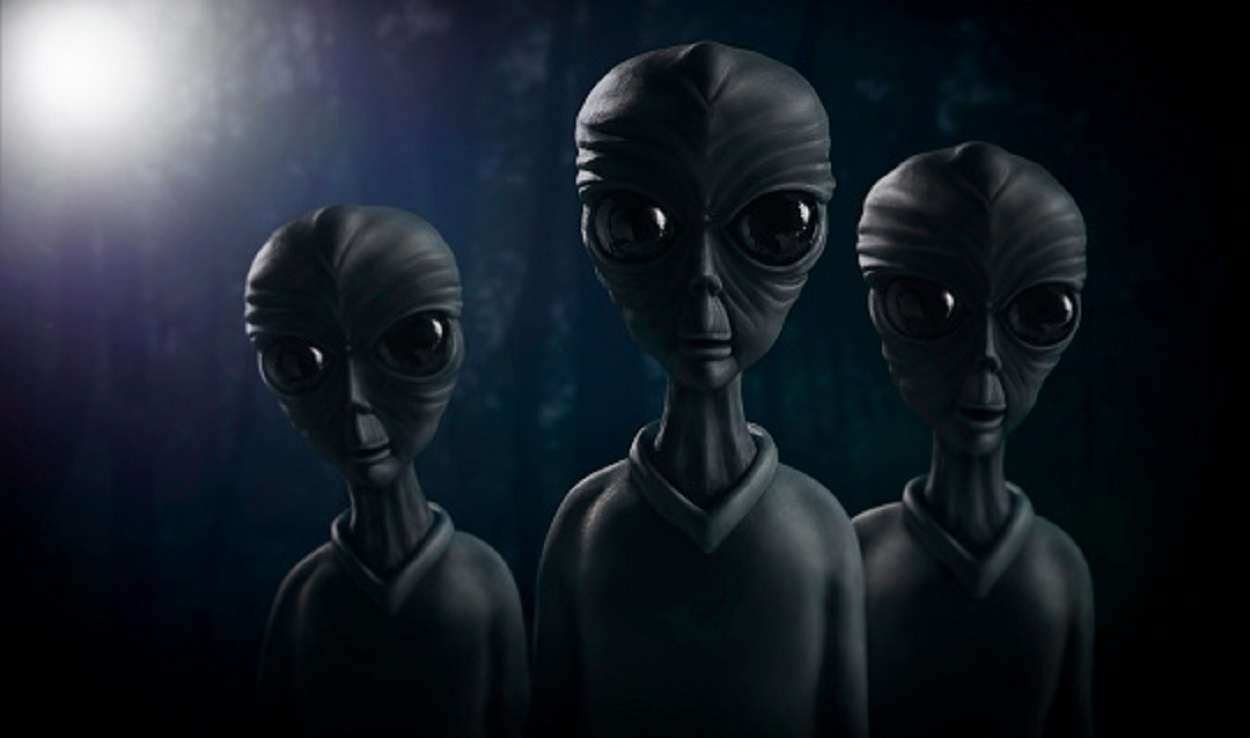 A depiction of three aliens