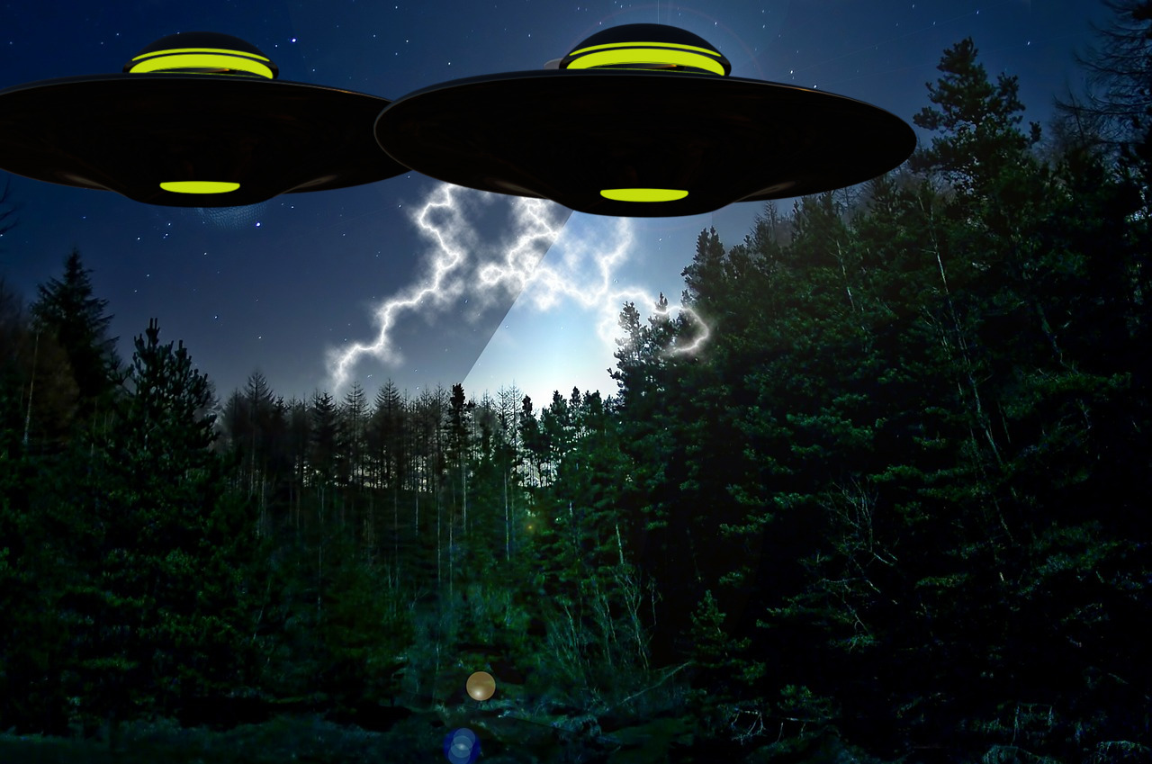 Depiction of two UFOs over the woods