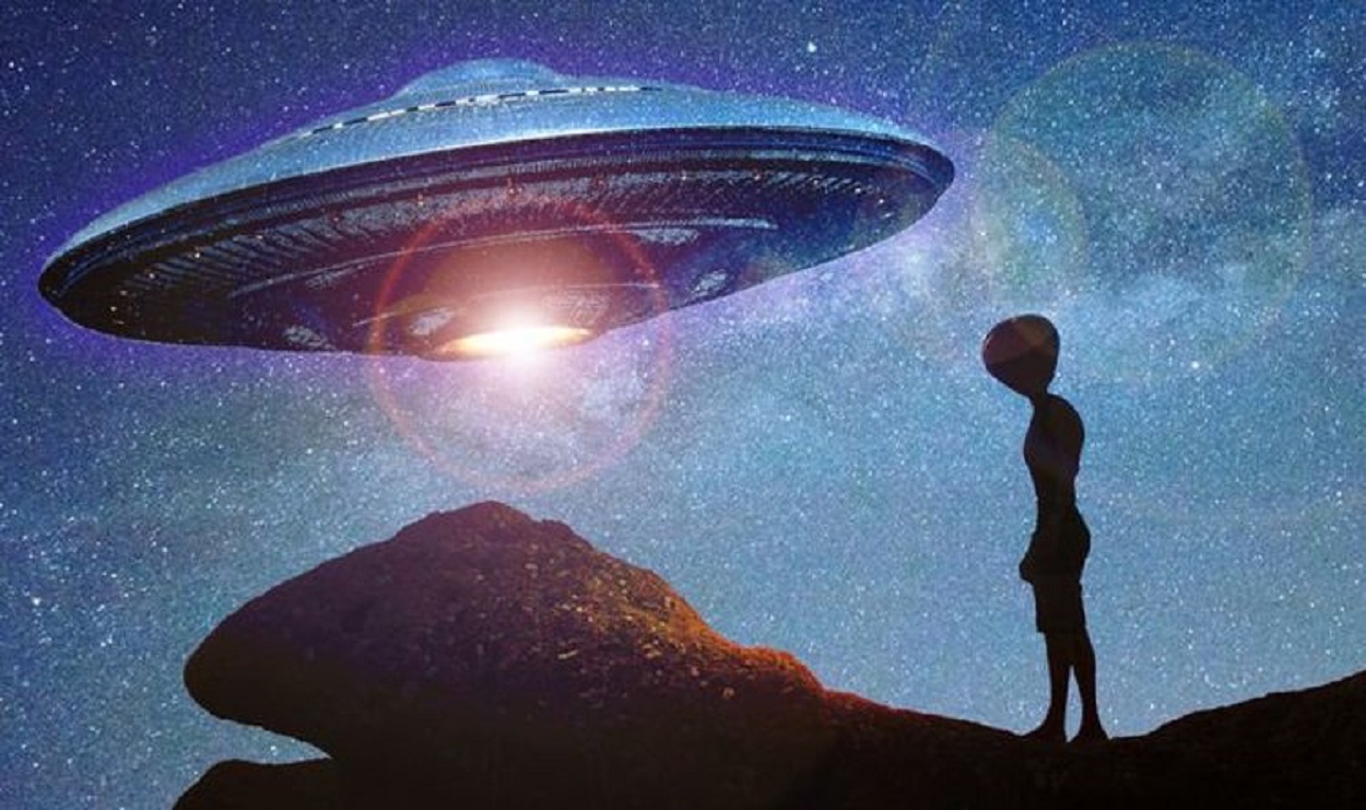 A depiction of an alien standing near a UFO