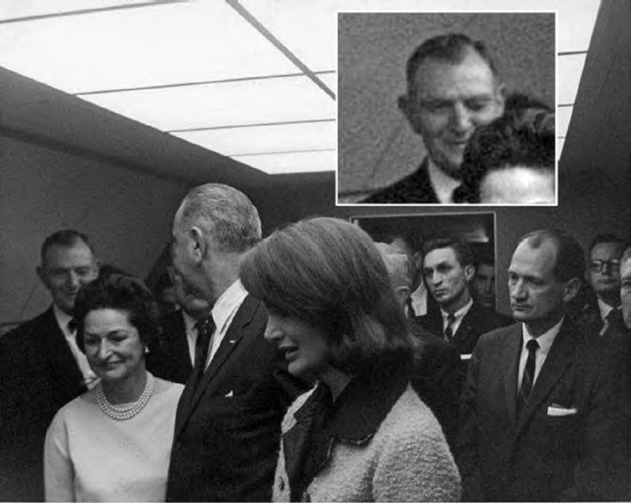 A picture showing Congressman Thomas winking at Lyndon Johnson