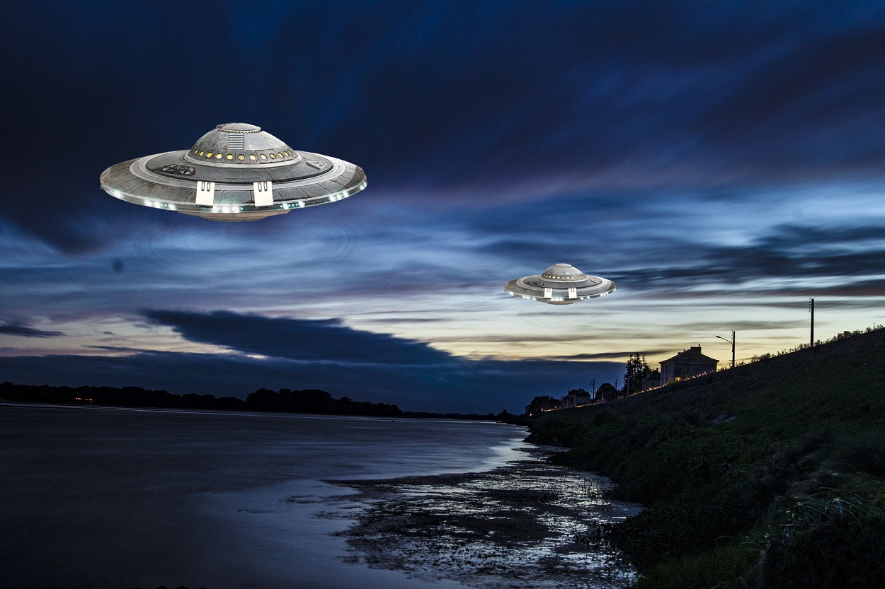 A depiction of two UFOs off the coast