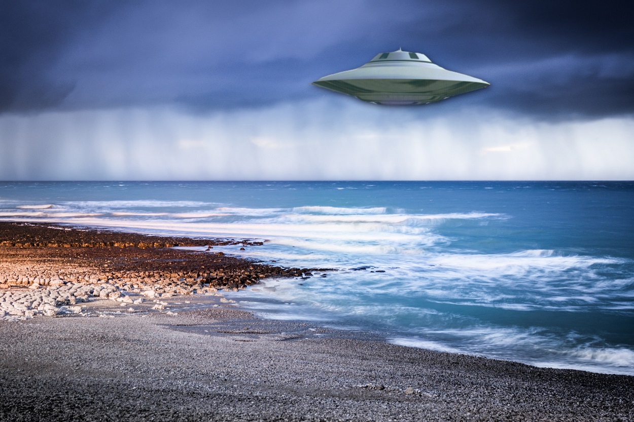 A depiction of a UFO over the coast