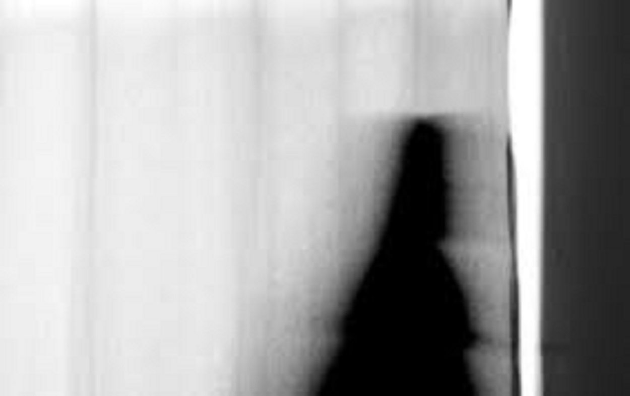 A depiction of a shadowy figure