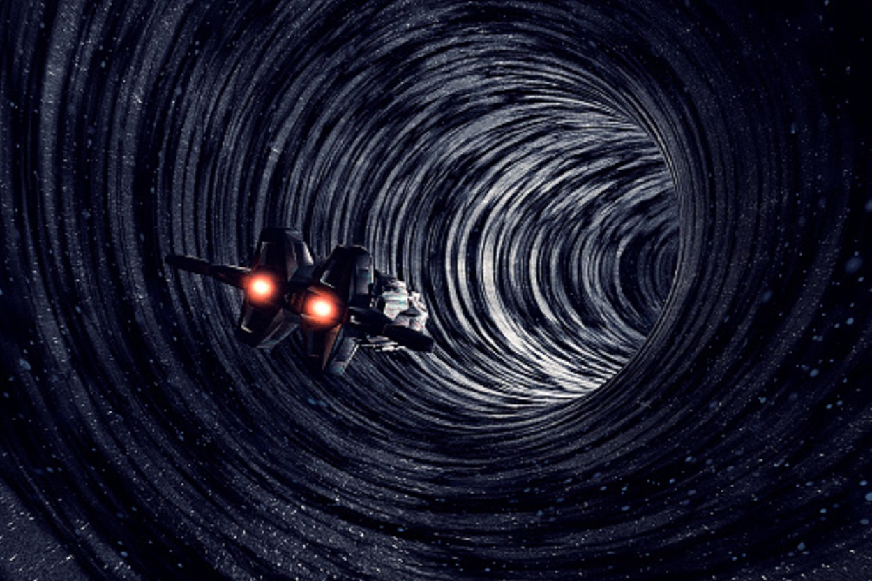 A depiction of a spacecraft entering a wormhole 