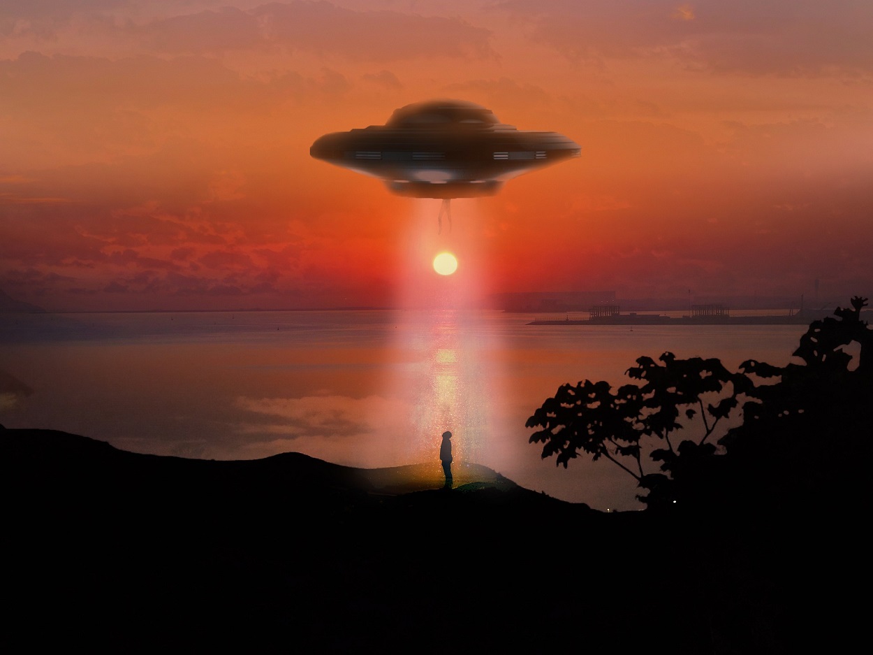 A depiction of a UFO over a person