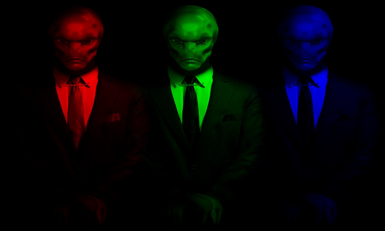 Three suited aliens 